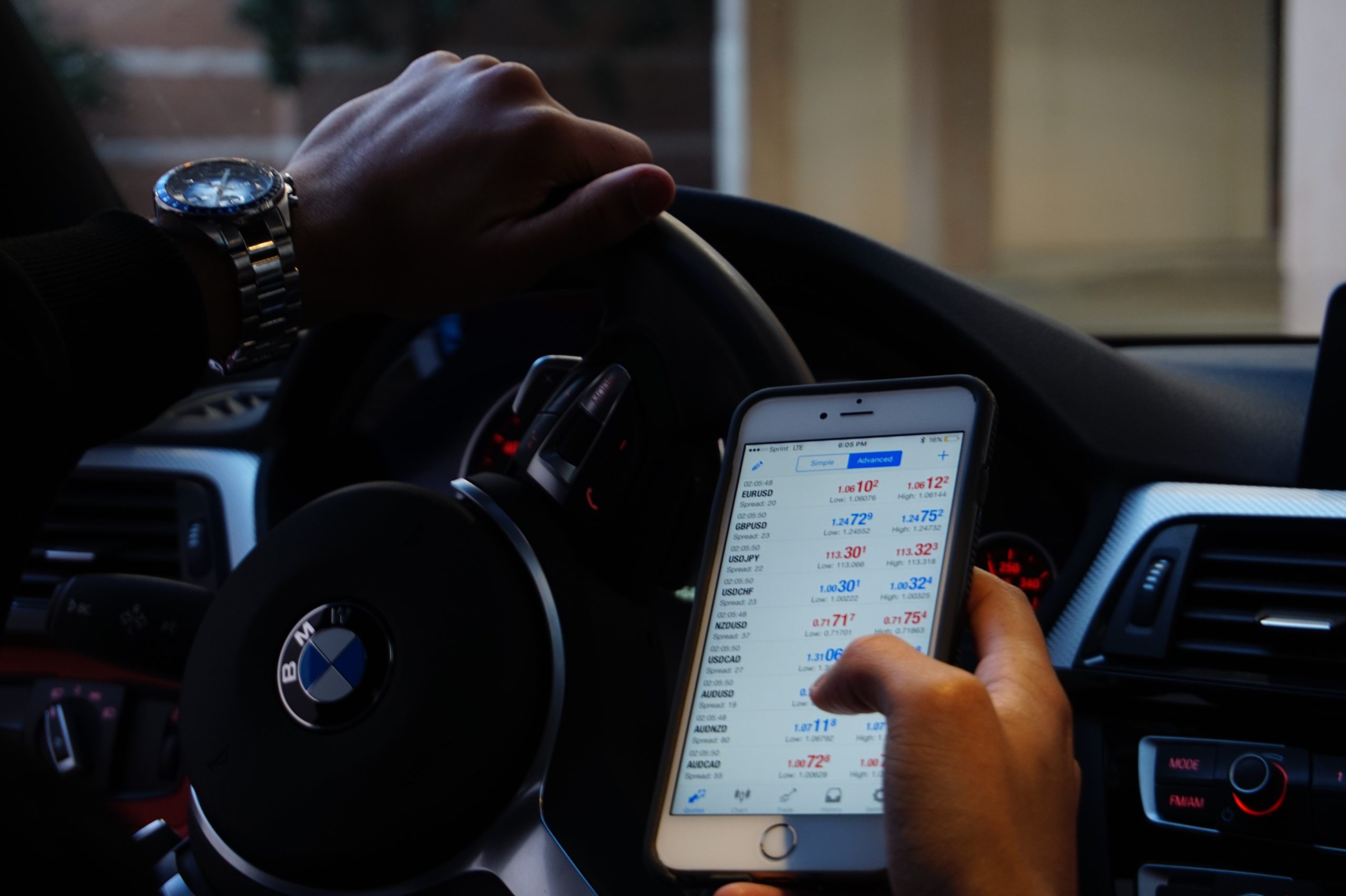Swing trader trading in a BMW car